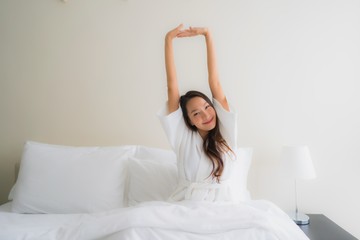 Portrait beautiful young asian women smile happy on bed