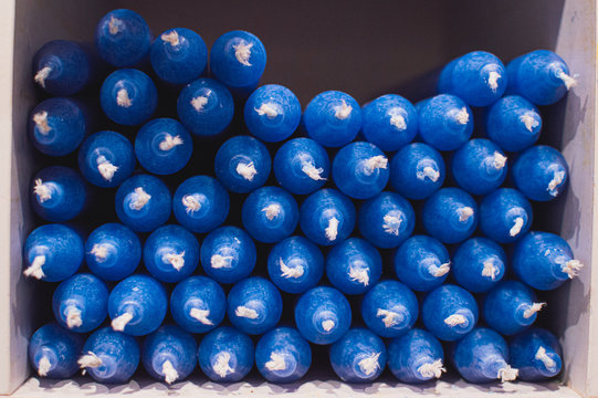blue Christmas candles. Close up picture of  blue  candles for christmas or valentines day. Neatly organised in a stack.