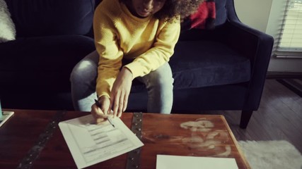 Young Black Woman Millennial Voting With Absentee Ballot At Home. 2020 Election.