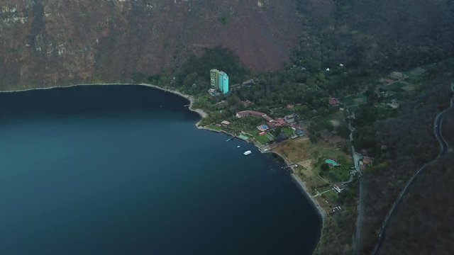 Aerial shot of Atitlan lake and a small town in Guatemala region of Solol&aacute;. 4k drone.