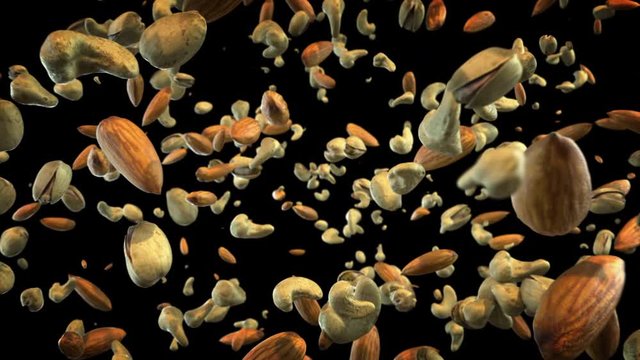 Mixed Nuts Exploding in Air. Slow Motion Animation of Almonds, Cashews and Pistachios Bursting and Flying Towards the Camera on Black Background. Healthy Diet Superfood.