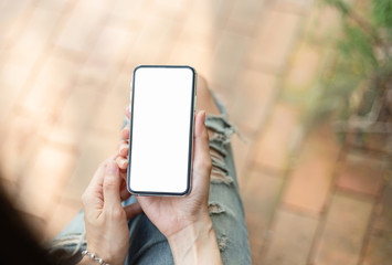 Mockup image blank white screen cell phone.man hand holding texting using mobile at outdoor.background empty space for advertise text.people contact marketing business,technology 