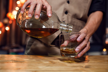Bartender Serve Whiskey, on wood bar,