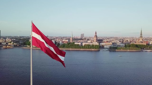 Latvia flag centered from left Riga city drone flight