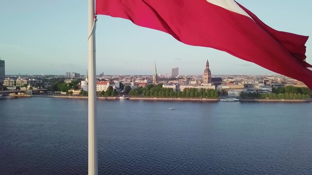 Latvia flag Riga city drone flight bottom to top