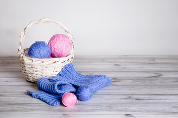 Basket with balls of wool.