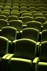 Obraz premium Green velvet seat in a theater