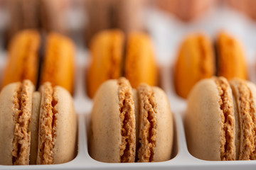 Colored french macaroons, sweets. Sale, assortment.