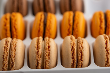 Colored french macaroons, sweets. Sale, assortment.