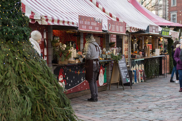 City Riga, Latvia. Christmas market with peoples and little street markets.