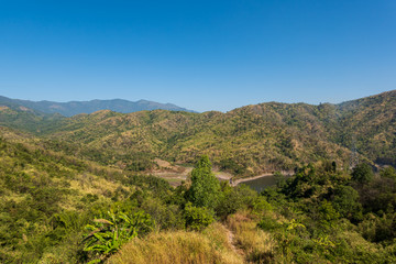 beautiful blue sky high peak mountains mist fog wildlife green forest at Khao Koh, Phu Tub Berk, Phetchabun, Thailand  guiding idea long weekend for backpacker camping campfire relaxing hiking