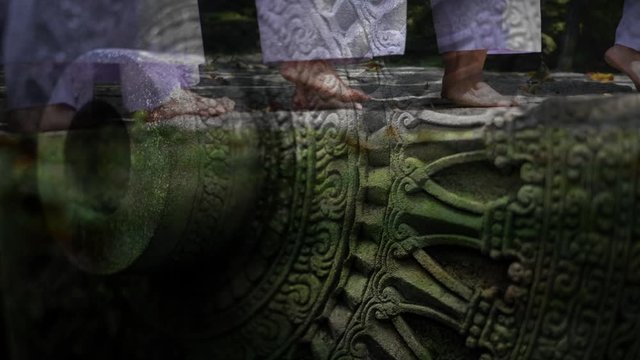 Mindfulness walking for Dhamma practitioners in the temple superimposed with a Wheel of Dhamma, Wheel of life, reflecting every breath in life for a meditation practice.