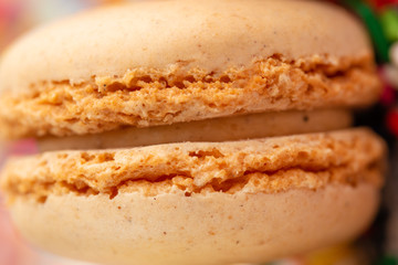 Macro, closeup of colored french macaroon, sweets with colored caramel sweets. Tastes and sweets.