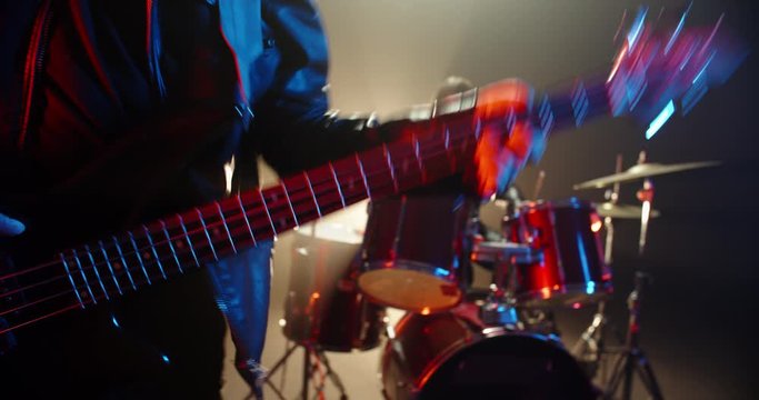 Rock duet performing. Professional guitarist and drummer rocking the party up in club, playing coll rock, punk or metal music 4k footage