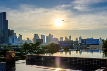 View beautiful swimming pool in condo at dusk landscape view on top bangkok thailand.