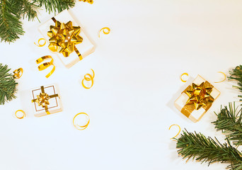 Flat Lay with presents gold bows pine fir