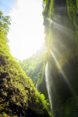 (Selective focus) Stunning view from the bottom to the top of the impressive Madikaripura waterfalls located in East Java, Indonesia.