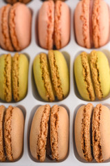 French macaroons, varied selection, colorful. Vertical photo.