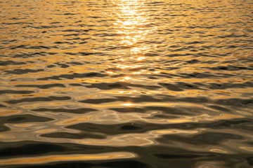 Surface of the water with sunset
