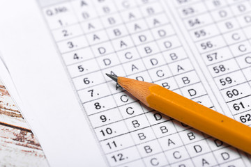 testing in exercise and exam paper. computer sheet with pencil in school test room, education concept