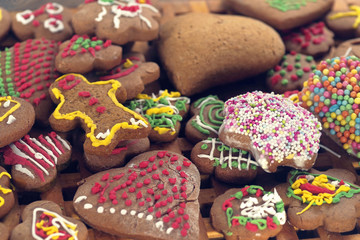 Fototapeta na wymiar Home made Christmas cookies as a gift for family and friends on wooden table