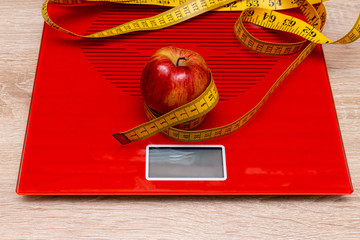 digital electronic scale with measuring tape. diet, slimming concept.