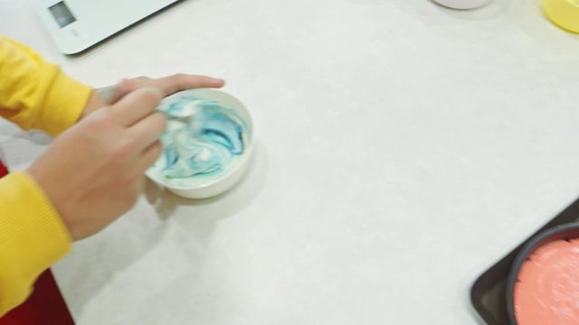 Mixing food colour into cake mix