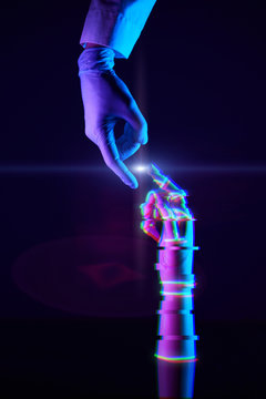 Touching fingers of engineer and digital technology that he creates. Acquaintance of man and technology.