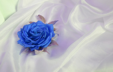 Fototapeta na wymiar Beautiful hand made silk flower. Vintage retro style decoration. Fashionable female corsage brooch and barrette. Classic Blue color. Color of the year 2020. Trendy color.