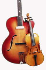 Obraz na płótnie Canvas Acoustic guitar and violin on a light background.