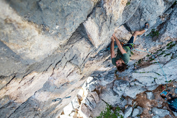 rock climber climbs a rock