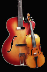 Fototapeta na wymiar Acoustic guitar and violin on a black background.