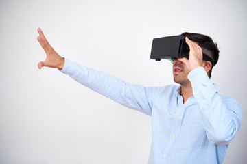 Businessman using virtual reality headset when working on presentation for ambitious project