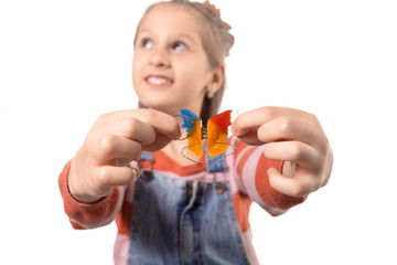Little girl with orthodontics appliance isolated on white background.