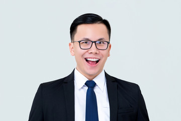 Delighted smiling Asian businessman in formal suit