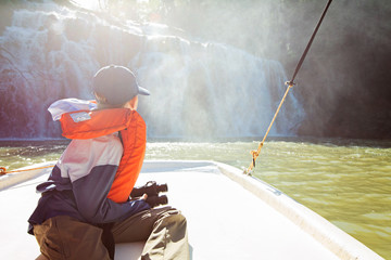 child enjoying waterfalls