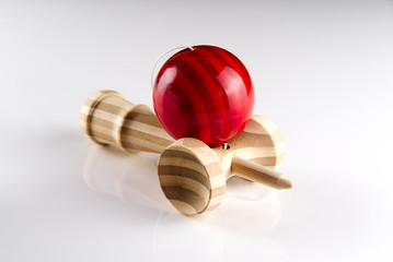 Kendama japanese wooden toy on isolated on white. Wood toy with red bal.