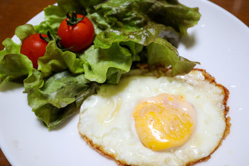 Fried egg eaten in the morning