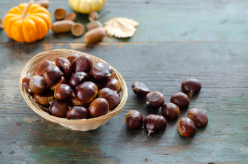 Edible chestnuts on the  wooden table.