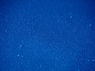 Water drops on blue background.