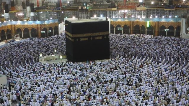 A fast forwarded of Muslim pilgrims perform circumambulation of the black stone (or Kaaba) in Mecca, Saudi Arabia.