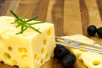 Piece of cheese close-up. cheese on a wooden board