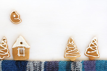 gingerbread house in a cookie forest, installation on a knitted scarf. sweet winter weekend