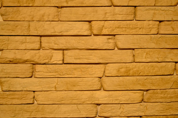 The texture of the bricks beige on the kitchen wall 