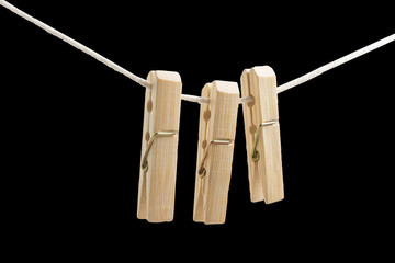 3 clothes peg on the rope black background