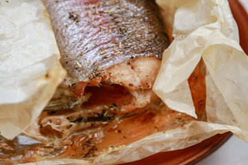 juicy appetizing baked salmon with herbs