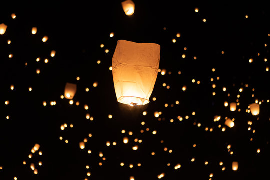 floating paper lanterns in the sky