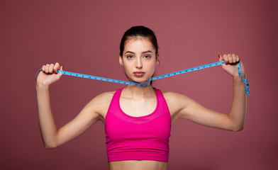 White young woman measuring her body.