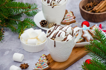 Hot vanilla chocolate in a white cup with marshmallows and chocolate glaze. Hot Christmas drink. Winter drink.