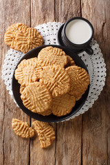 peanut butter cookies with milk close-up. Vertical top view